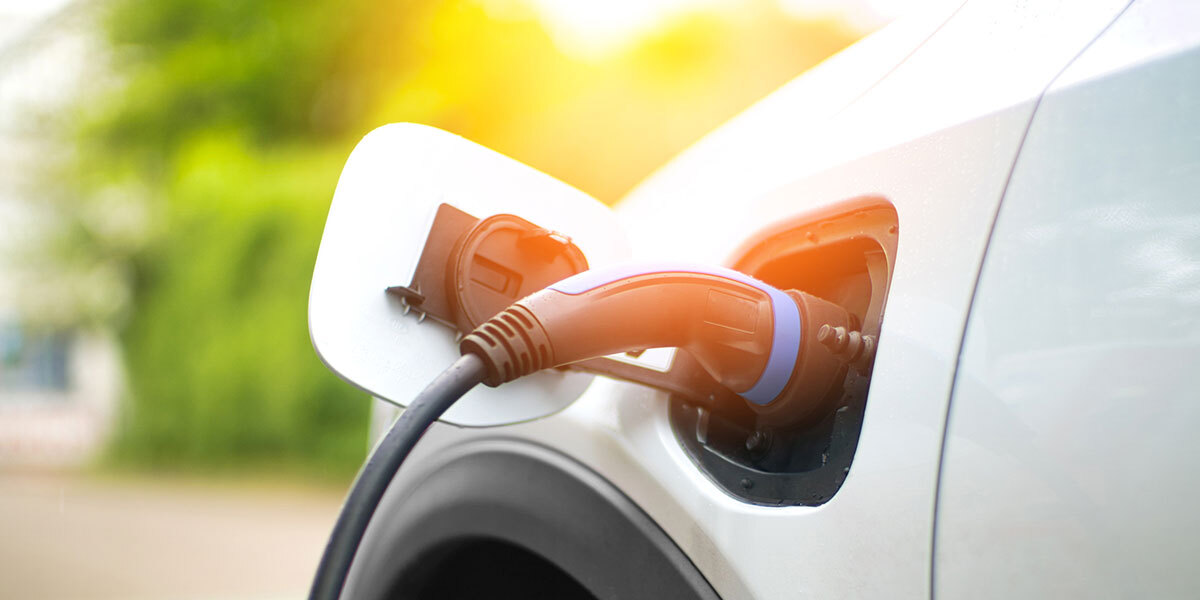 Electric Car Charging At Power Station